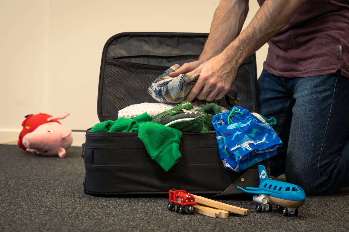 Packing a suitcase for a family vacation